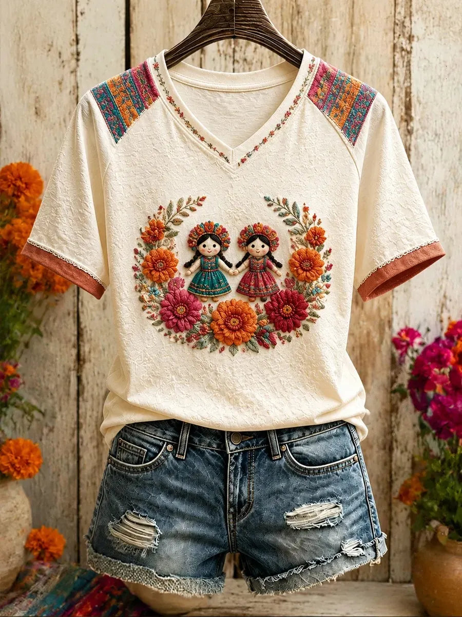 Women's Twin Folk Dolls in Marigold Wreath Print V Neck Raglan T-Shirt